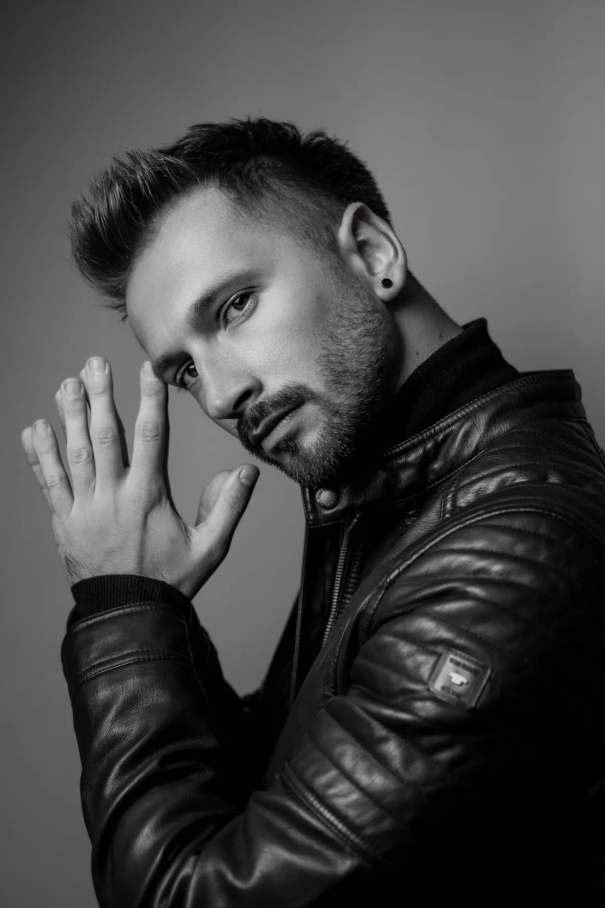 Choreographer Chris Trybuś looking towards the camera photographing him.